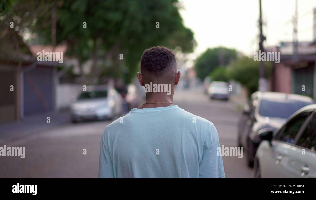 Back view of young man strolling hi-res stock photography and images ...