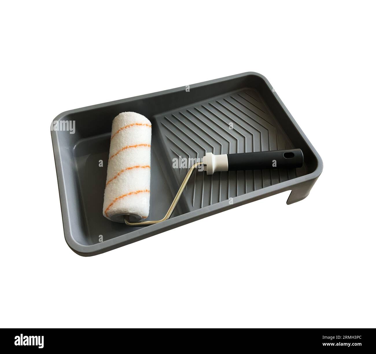 Paint roller in empty tray working tools isolated with clipping path object for making repair works Stock Photo
