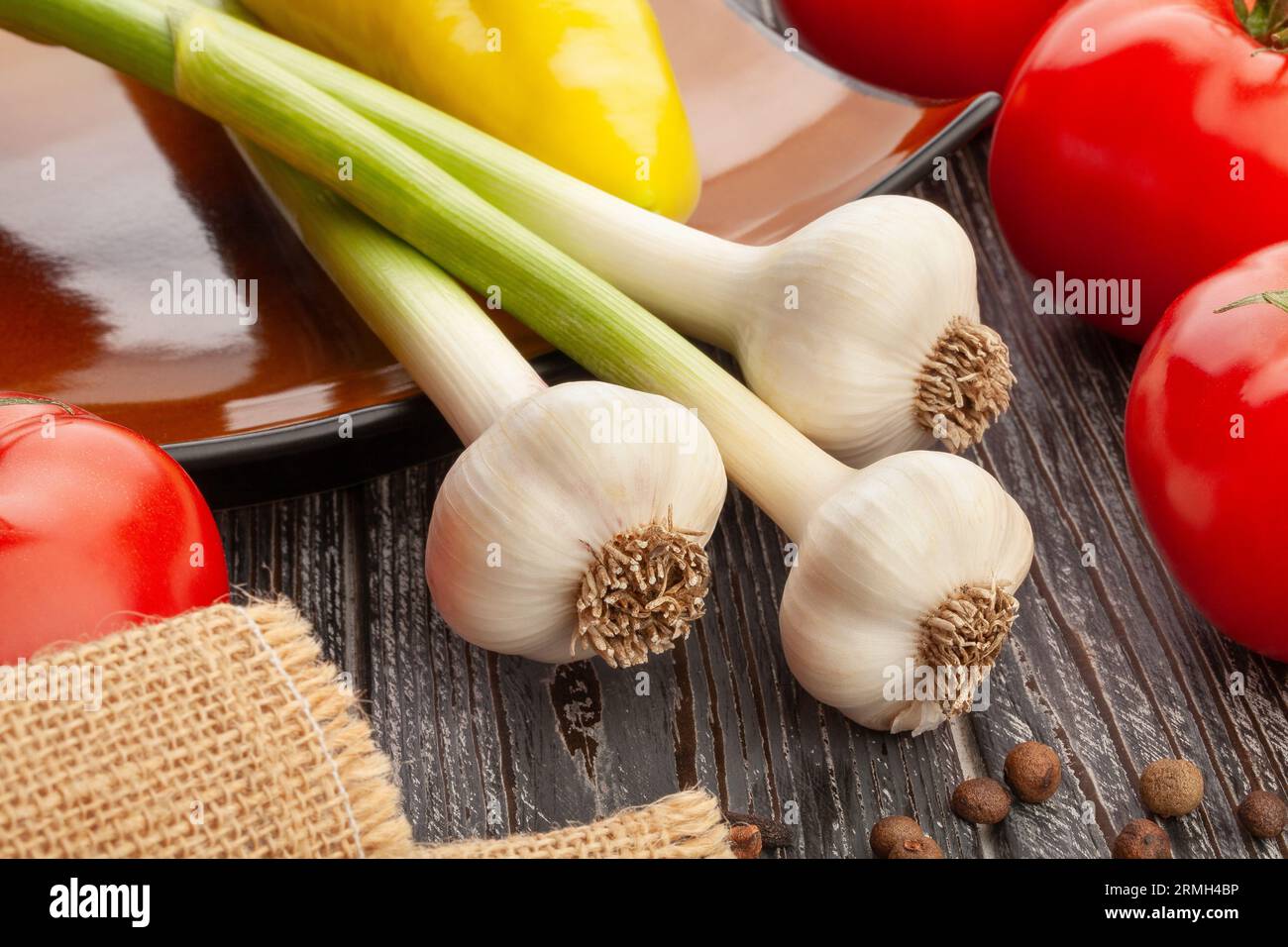 young garlic on wood background Stock Photo