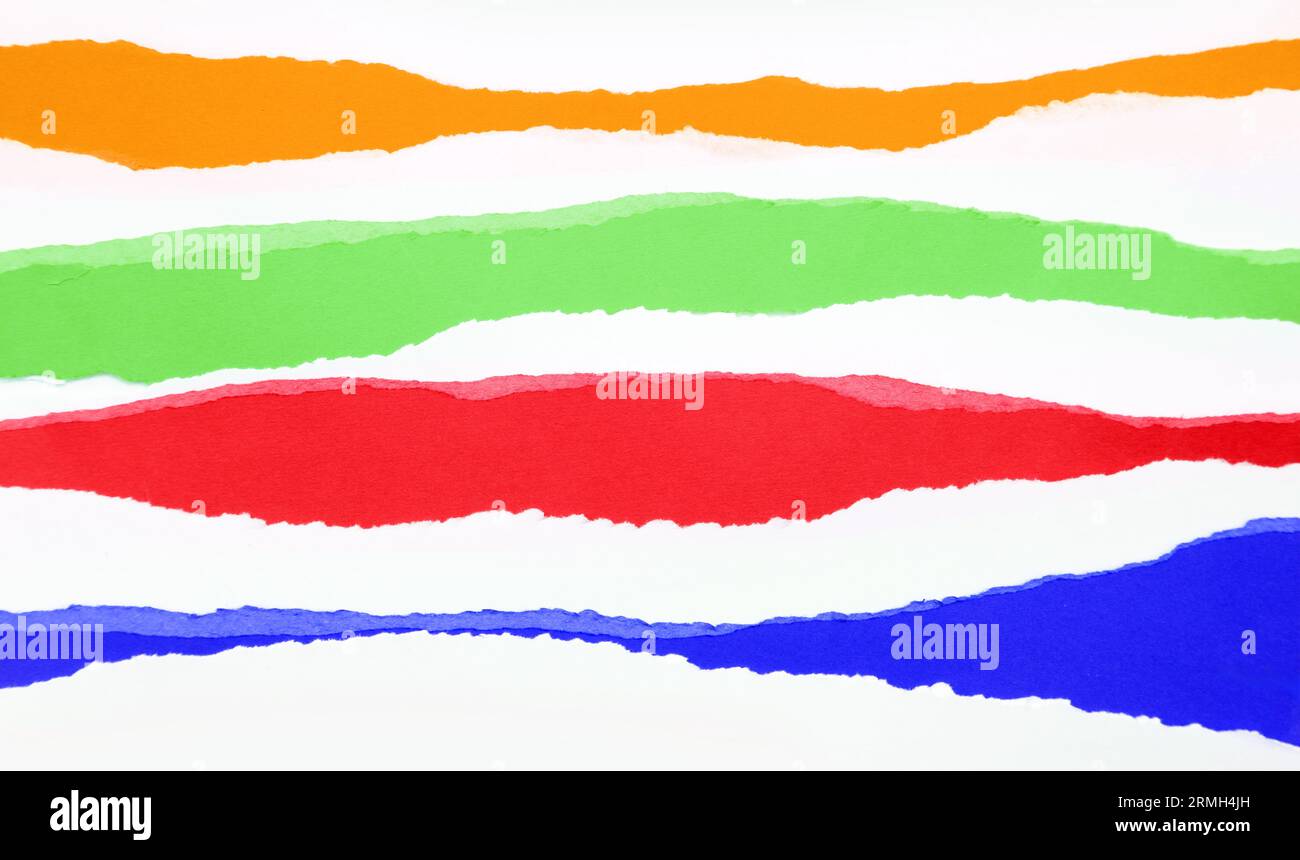 Torn orange, green, red and blue papers background Stock Photo