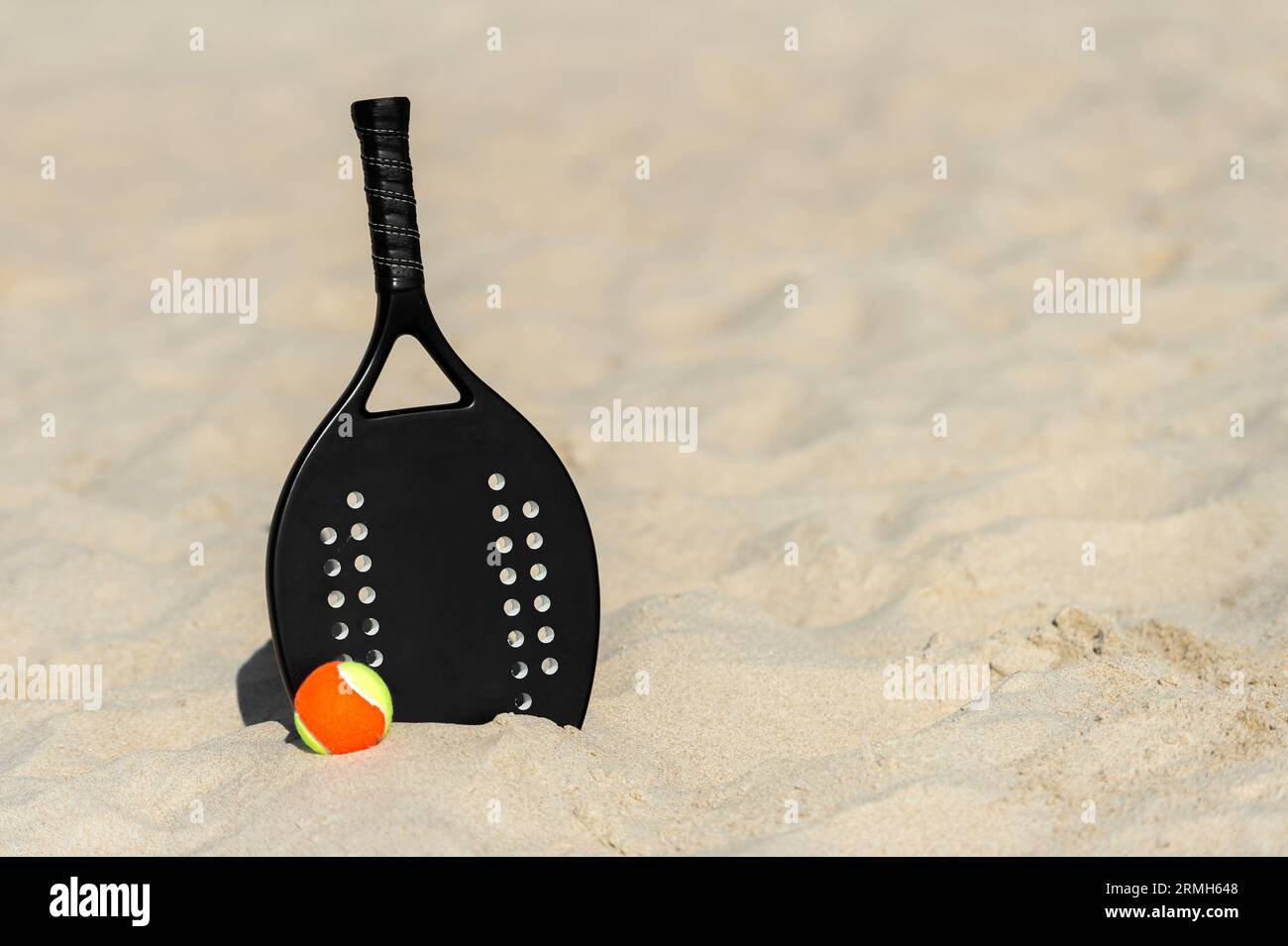 Racket and ball on the sandy beach. Summer sport concept. Horizontal sport theme poster, greeting cards, headers, website and app Stock Photo