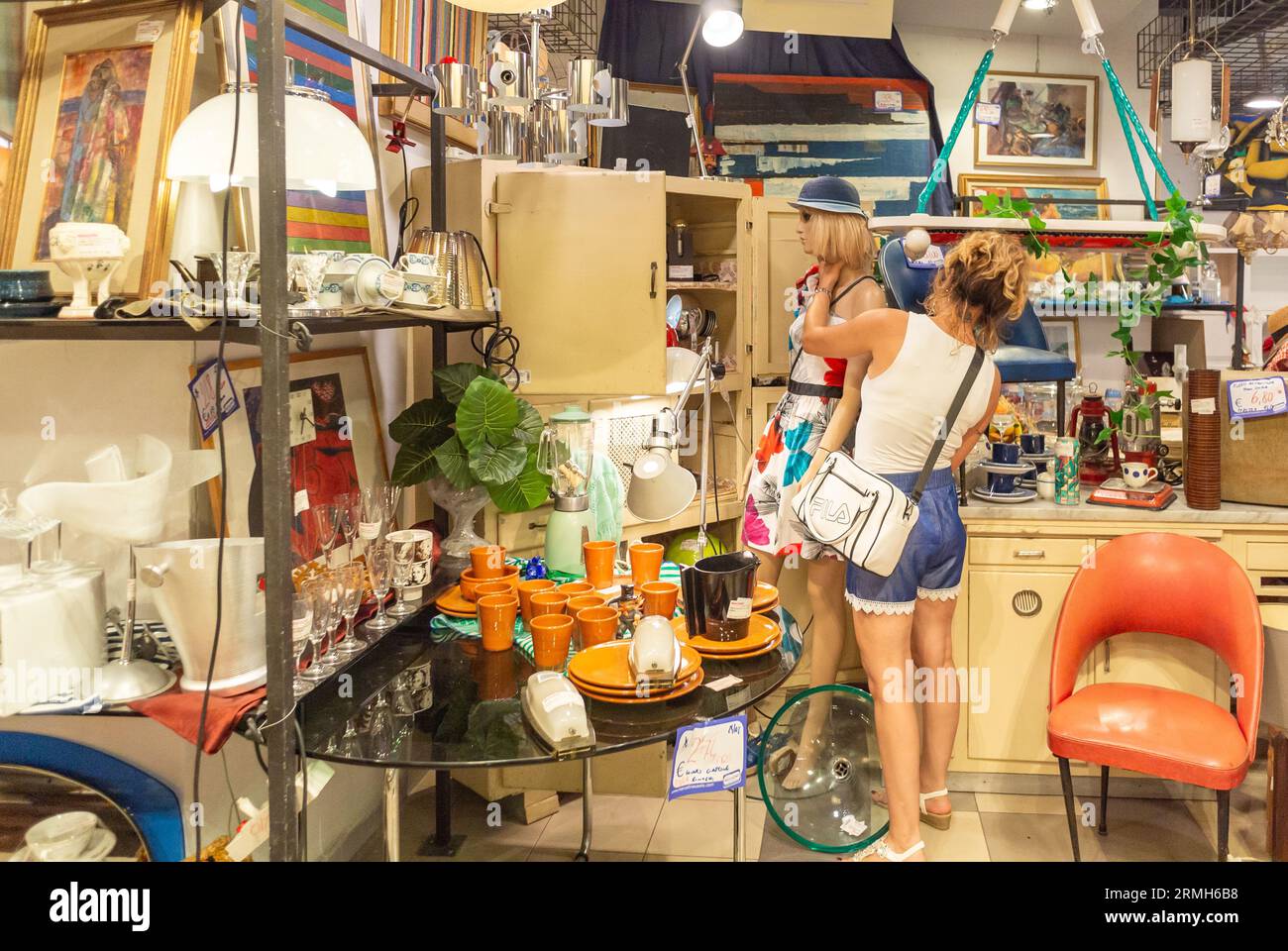 Rome, Lazio, Italy, Female customer looking at clothings in Mercatino Franchising Porta Maggiore Stock Photo