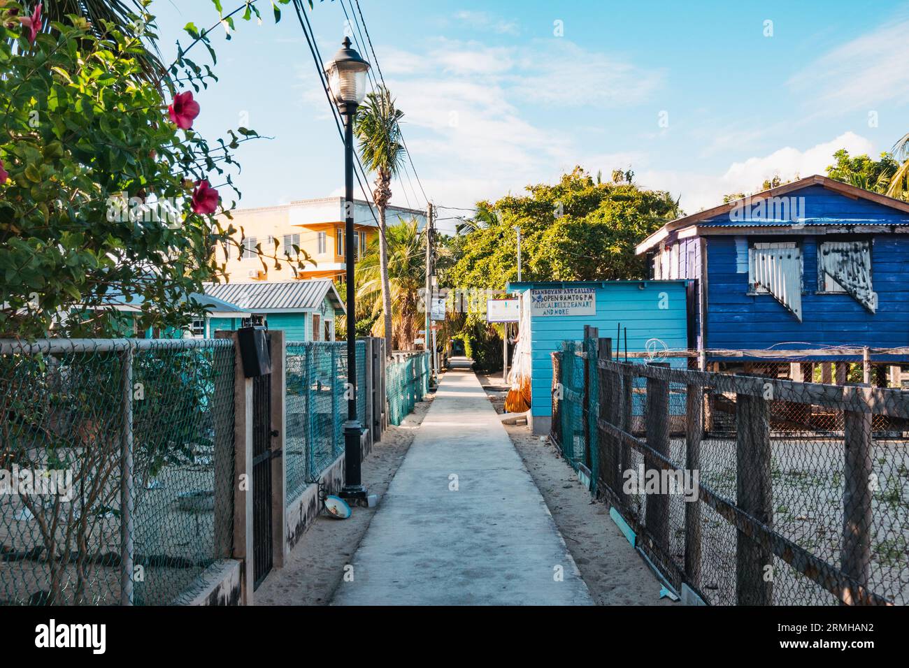 the main path through Placencia township, Belize. An urban legend alleges it holds the Guinness World Record for 'narrowest main street' Stock Photo