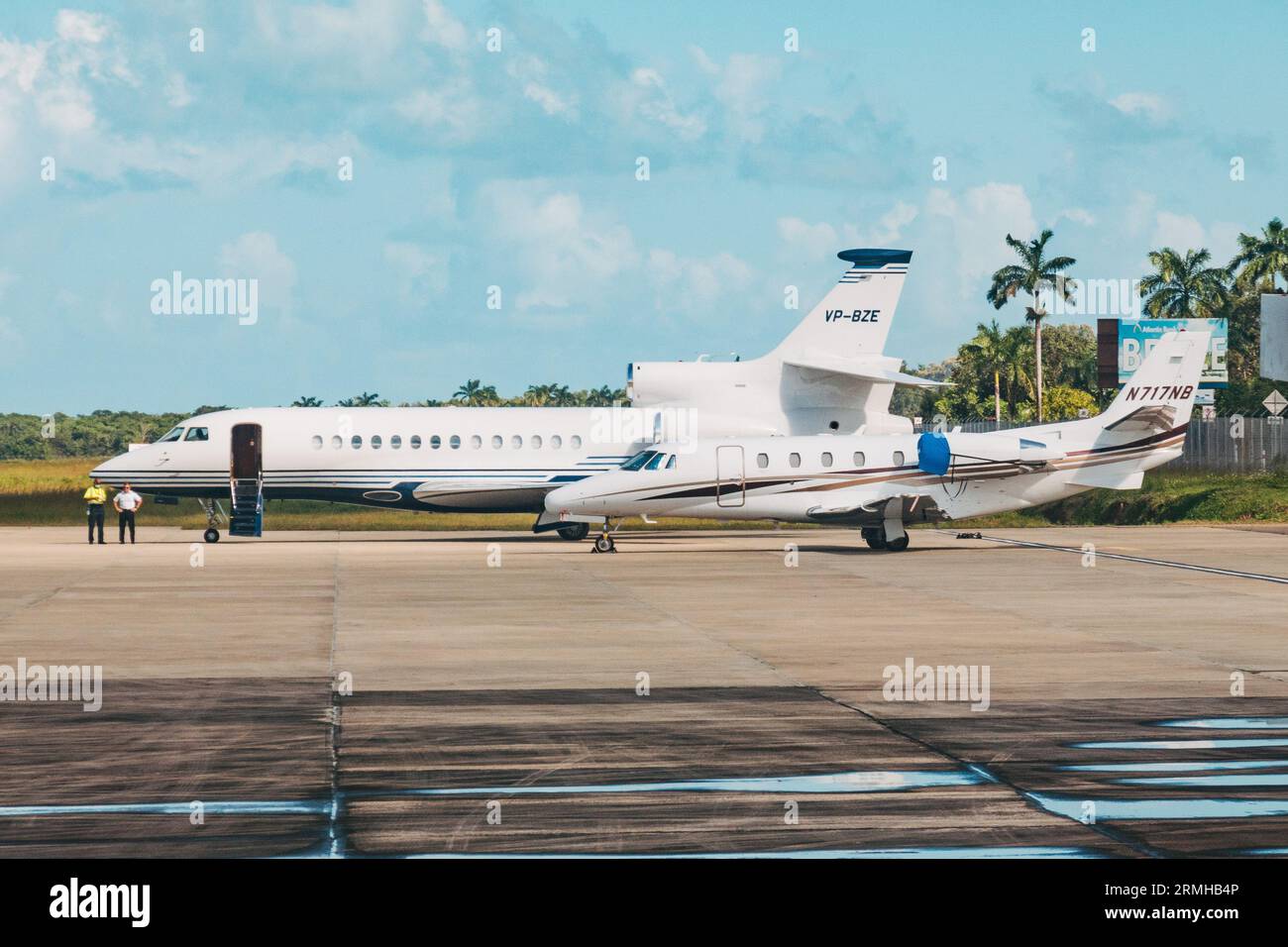 private jets parked at Philip S.W. Goldson International Airport