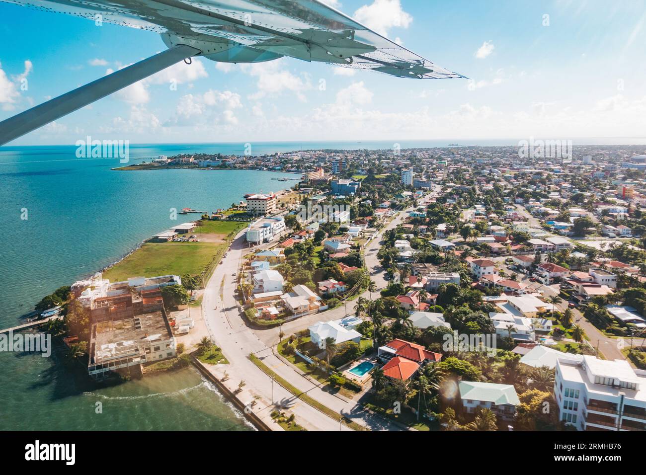 looking out the window over Belize City on an island hopping flight from Sir Barry Bowen Municipal Airport Stock Photo