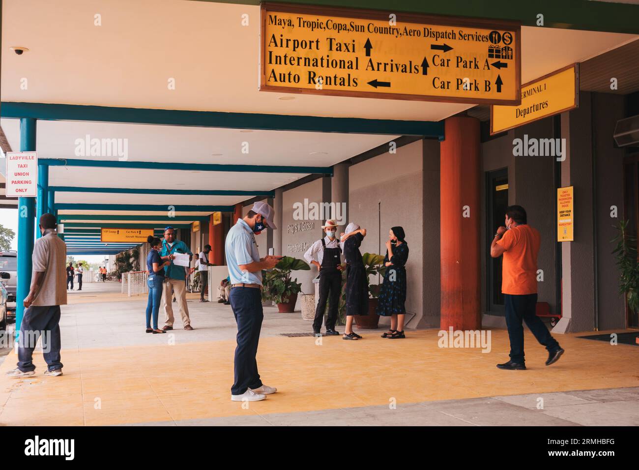 the arrivals exit area outside Philip S.W. Goldson International Airport, Belize City Stock Photo