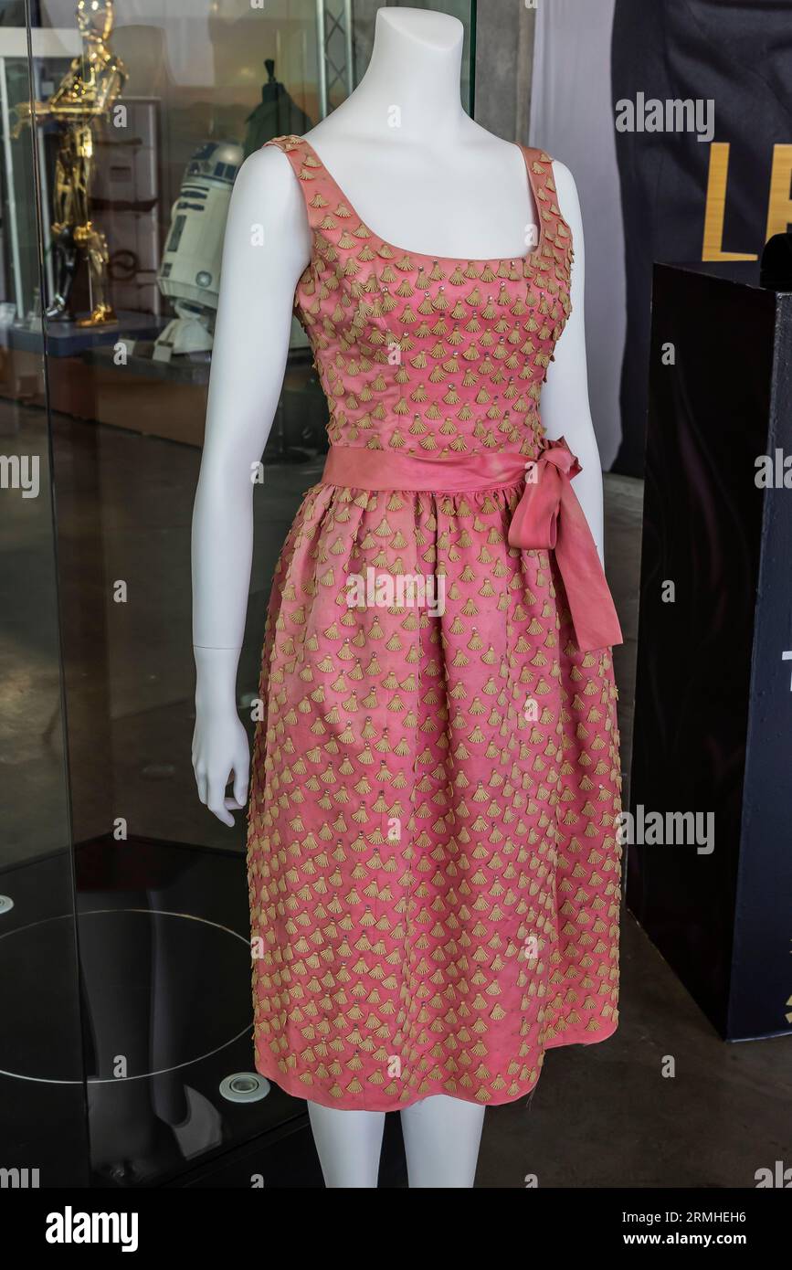 Beverly Hills, USA. 28th Aug, 2023. Julien's Auctions And Turner Classic Movies Present “LEGENDS: HOLLYWOOD AND ROYALTY” Auction. Various memorabilia from Hollywood films and TV show to be auctioned. Audrey Hepburn's flamingo pink embellished silk-organza dress (photo above left) worn in her iconic role as Holly Golightly in Blake Edward's 1961 film classic Breakfast at Tiffany's. 8/28/2023 Beverly Hills, CA., USA (Photo by Ted Soqui/SIPA Photo USA) Credit: Sipa USA/Alamy Live News Stock Photo