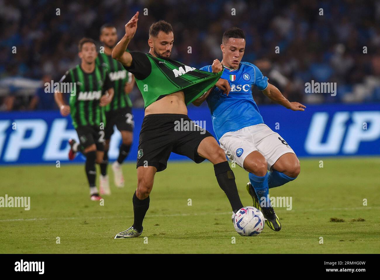 Naples, Italy. 27 Aug, 2023. Nedim Bajrami of US Sassuolo competes for the ball with Giacomo Raspadori of SSC Napoli during the Serie A match between Stock Photo