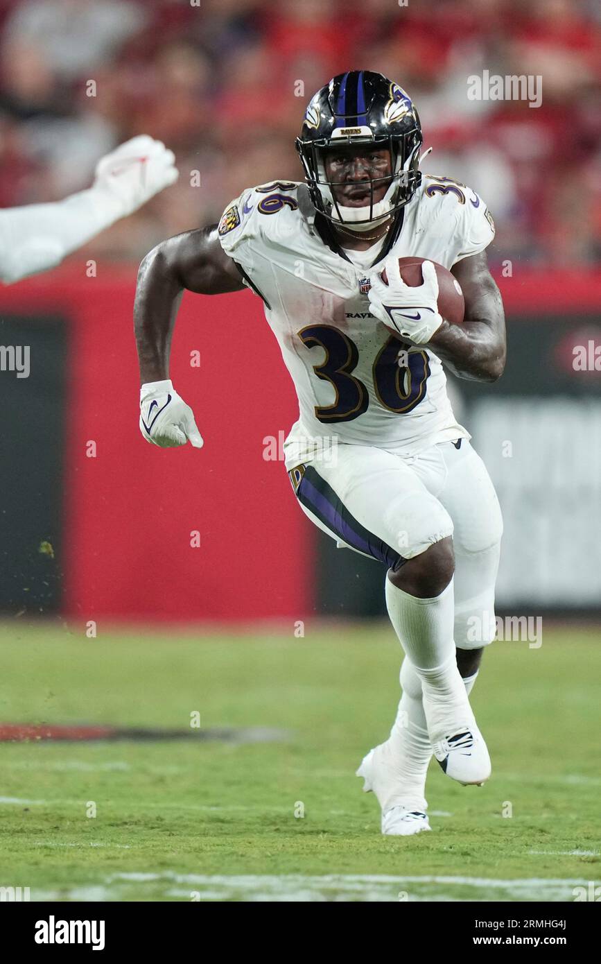 Baltimore Ravens running back Owen Wright (36) finds running room as he  rushes with the ball during an NFL preseason football game against the  Tampa Bay Buccaneers, Saturday, Aug. 26, 2023, in