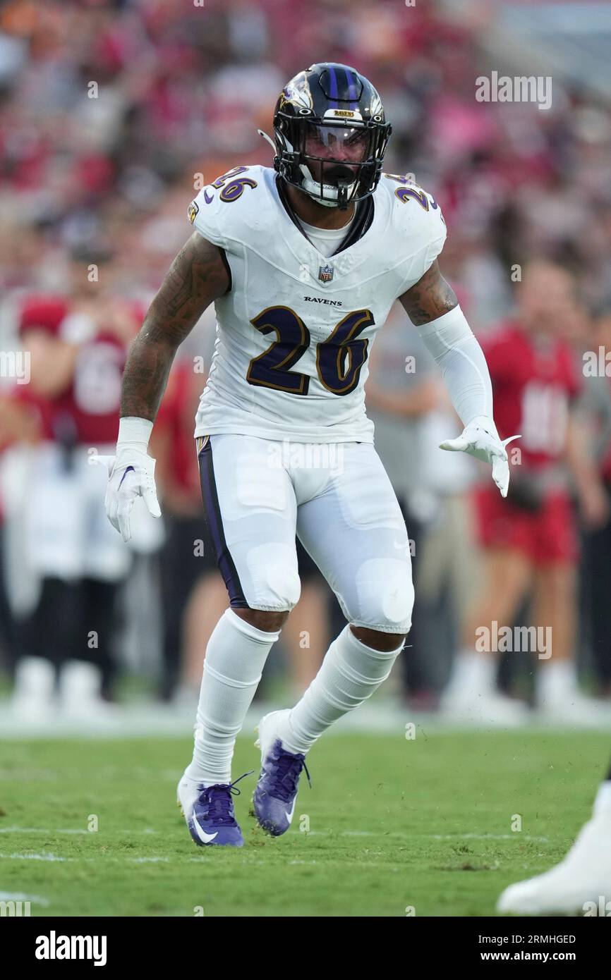 Baltimore Ravens safety Geno Stone (26) drops back in coverage as he  defends during an NFL preseason football game against the Tampa Bay  Buccaneers, Saturday, Aug. 26, 2023, in Tampa, Fla. (AP