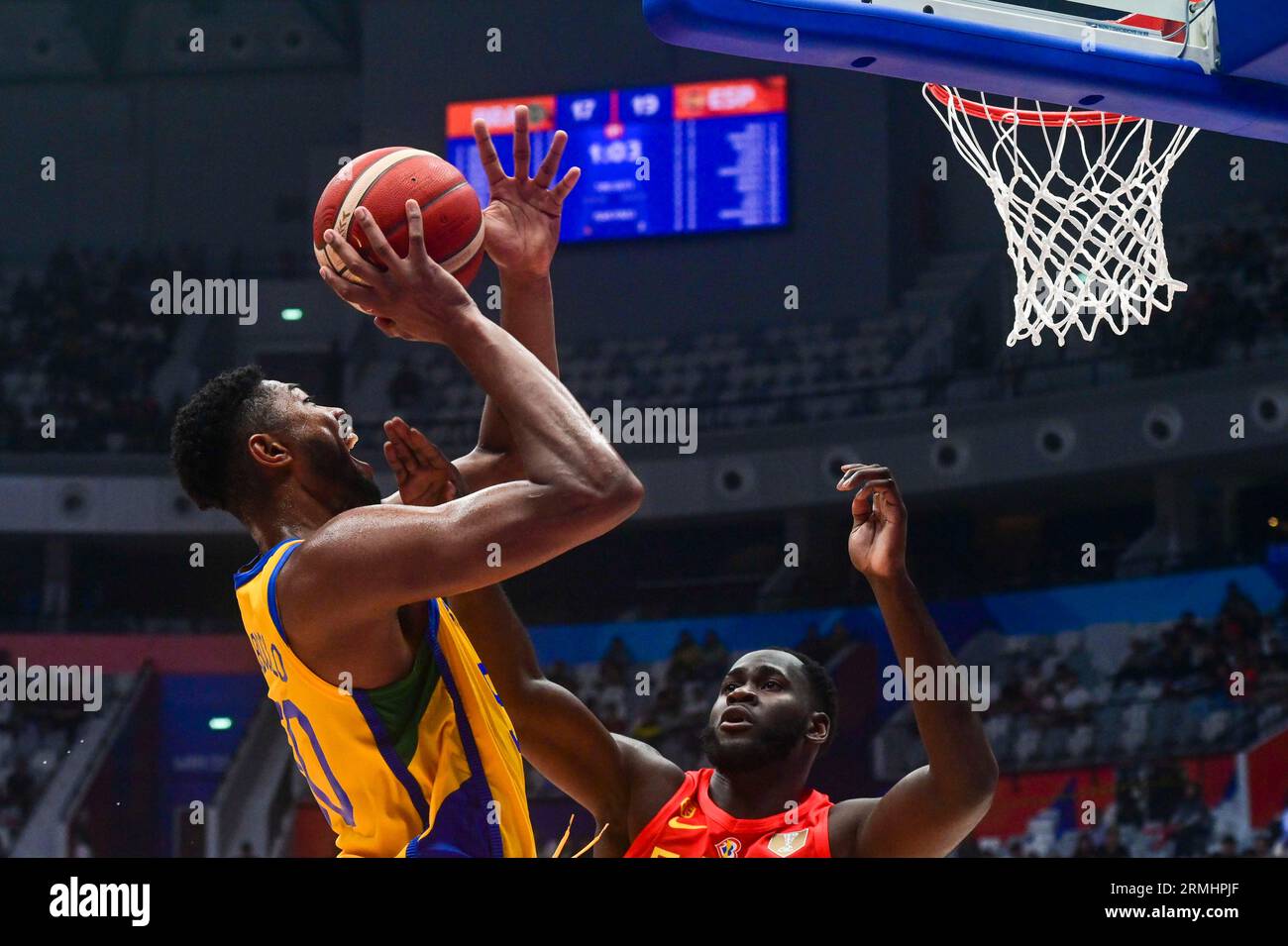 Jakarta, Indonesia. 28th Aug, 2023. Bruno Caboclo (top) of Brazil goes for a lay-up during the Group G match between Brazil and Spain at the FIBA World Cup 2023 in Jakarta, Indonesia, Aug. 28, 2023. Credit: Zulkarnain/Xinhua/Alamy Live News Stock Photo