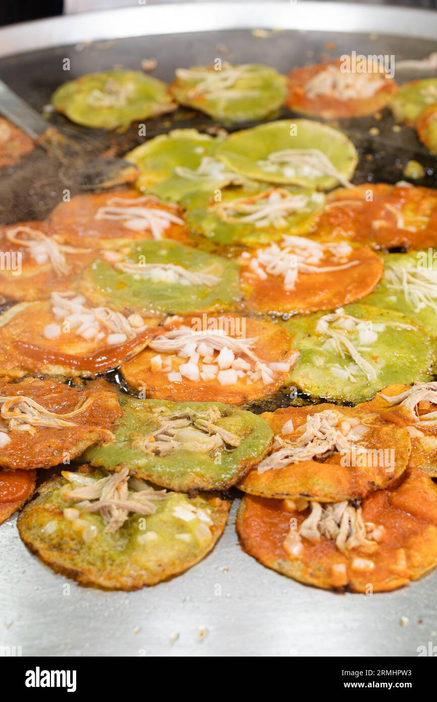 chalupas poblanas submerged in lard, mexican food from the city of