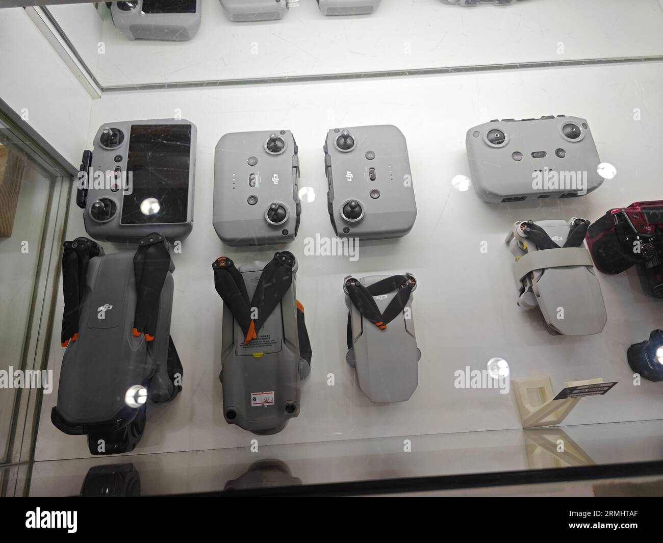 DJI drone with controller set on display and sale on one of the camera store at the shopping mall. Stock Photo