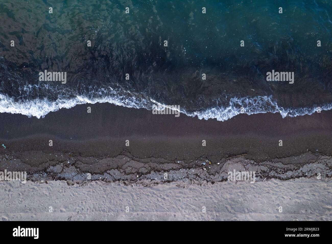 Lapping waves on sandy hi-res stock photography and images - Alamy