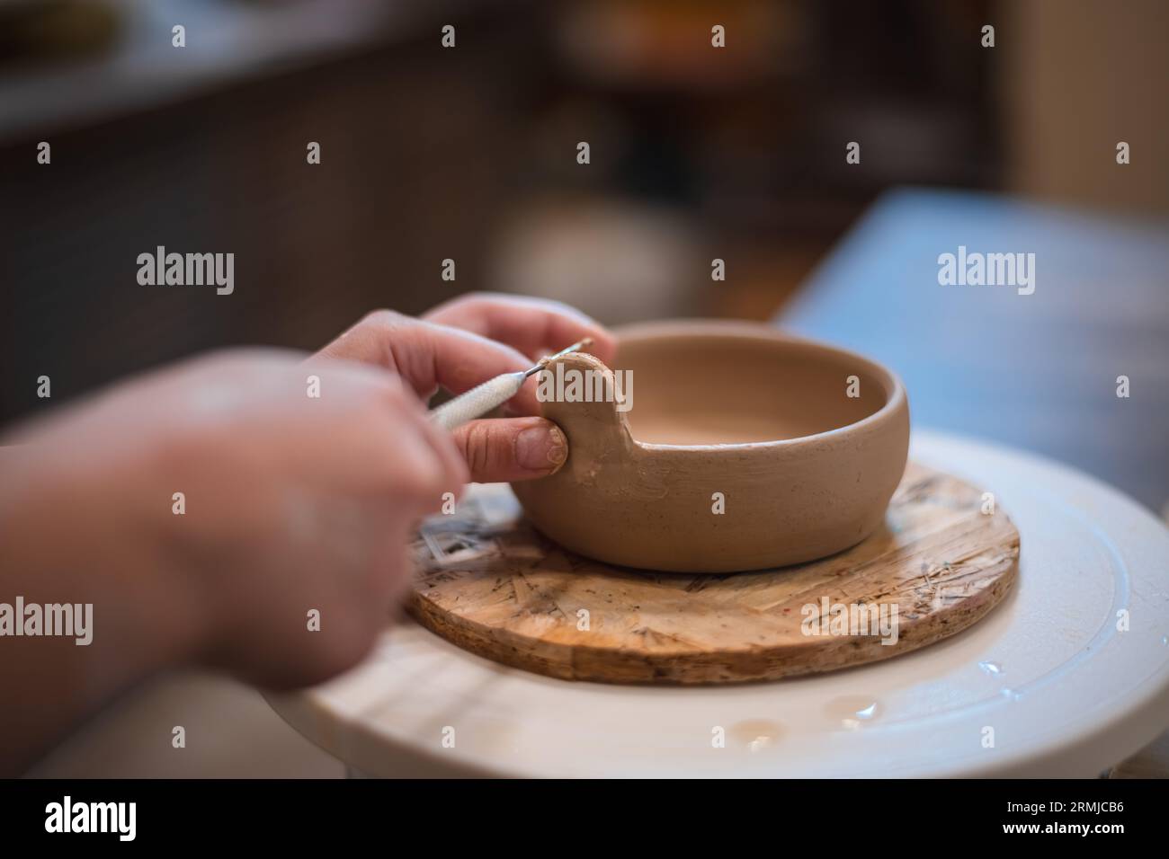 girl hands, pottery studio and painting cup in for makes a