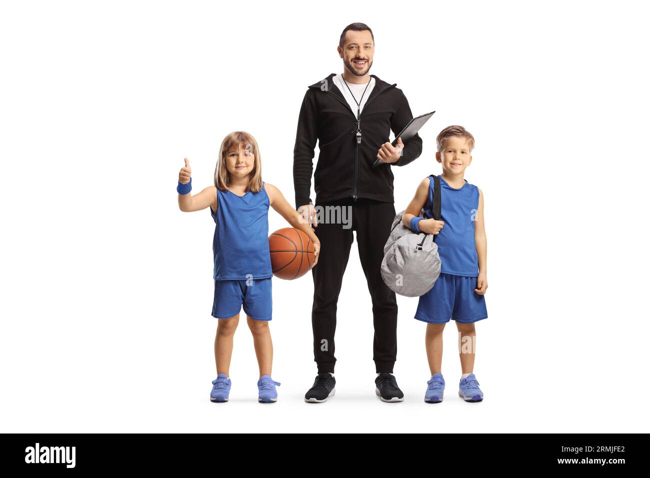 Basketball coach standing with a boy and girl in sport jerseys isolated on white background Stock Photo