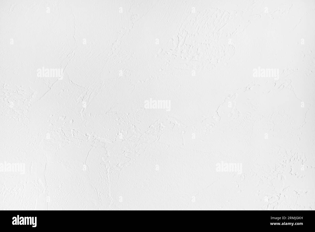 Rough surface of a white painted plastered wall of a living room as a background and copy space Stock Photo