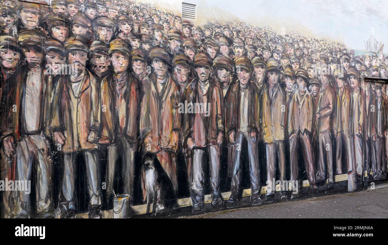 Northern Ireland, Belfast mural in Donegall Road which features a crowd of shipyard workers to