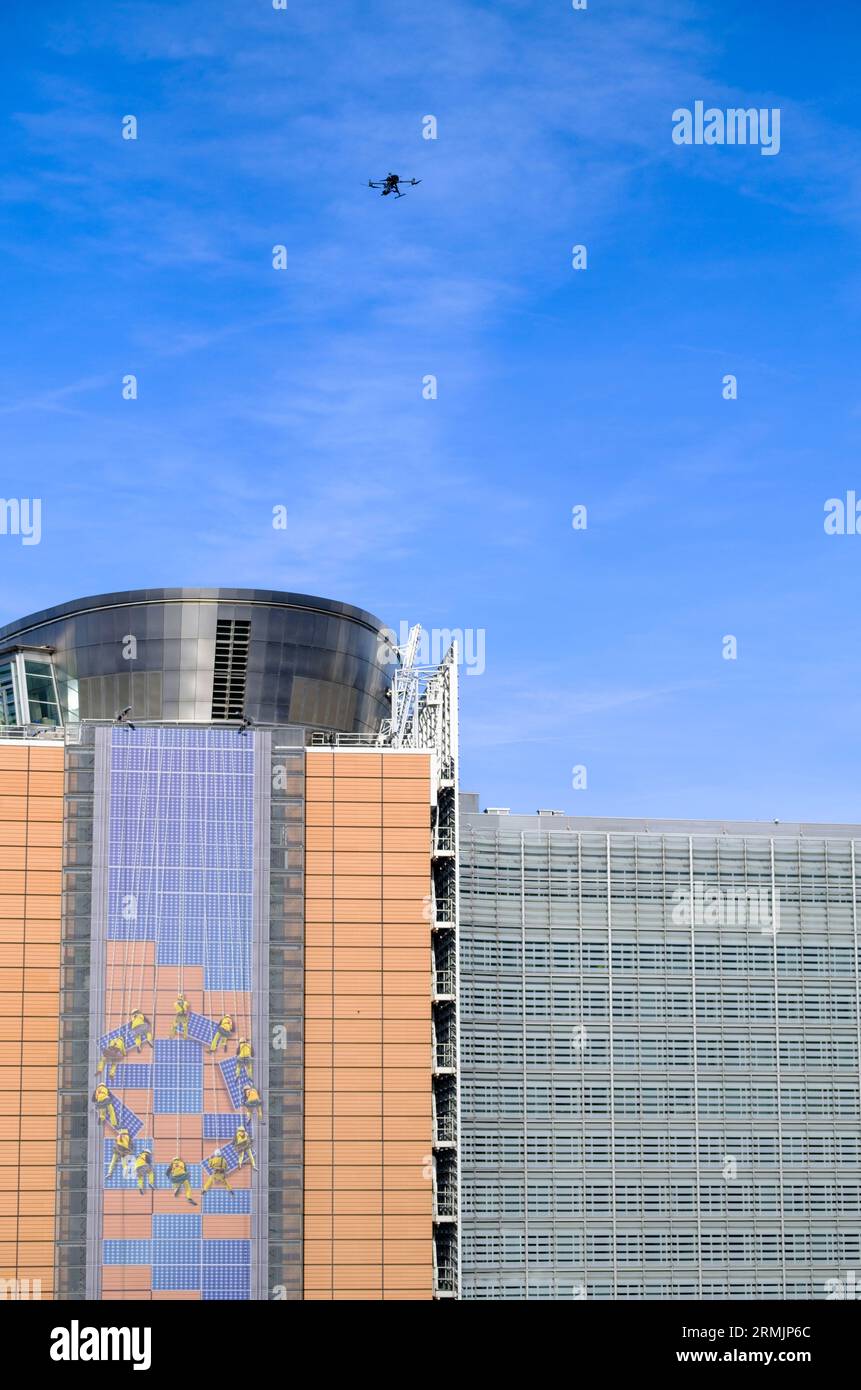 Belgium, Brussels: police drone in the sky flying over the European Commission Headquarters, the Berlaymont building Stock Photo