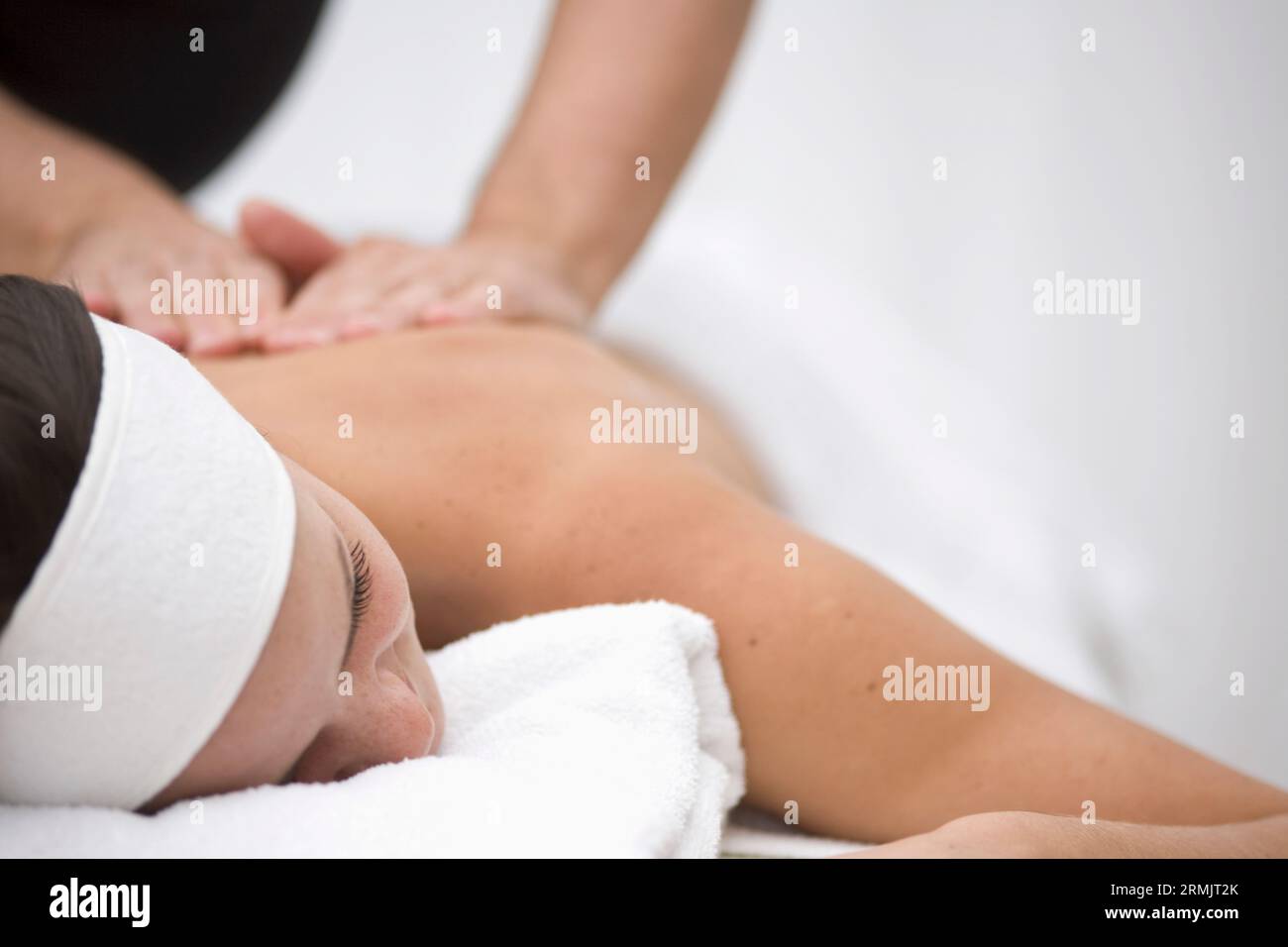 Woman receiving a back and shoulder massage Stock Photo