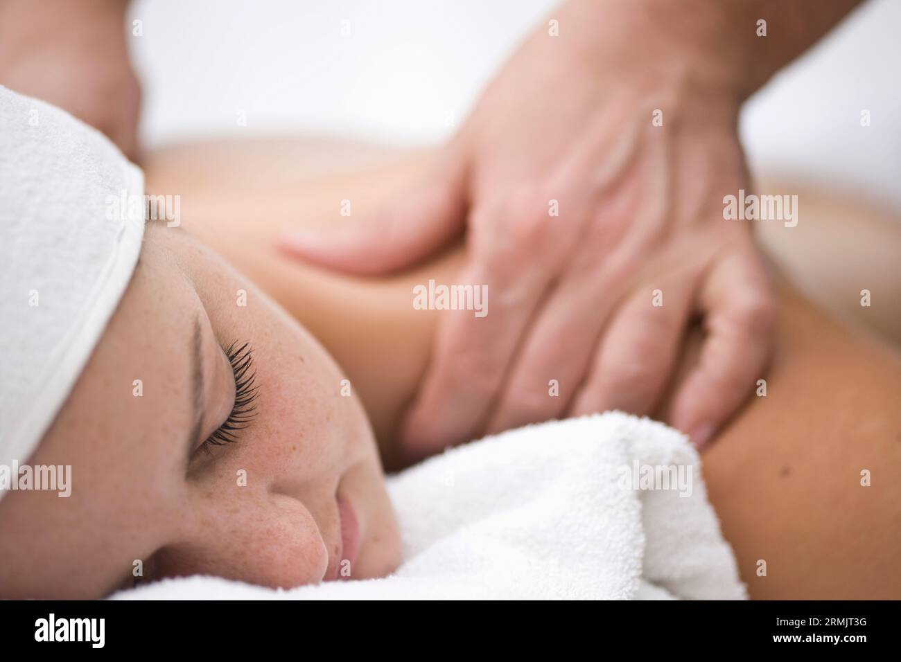 Woman receiving a back and shoulder massage Stock Photo