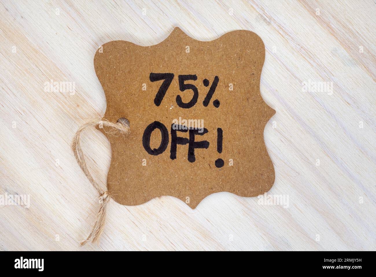 75% off written on vintage gift tag Stock Photo