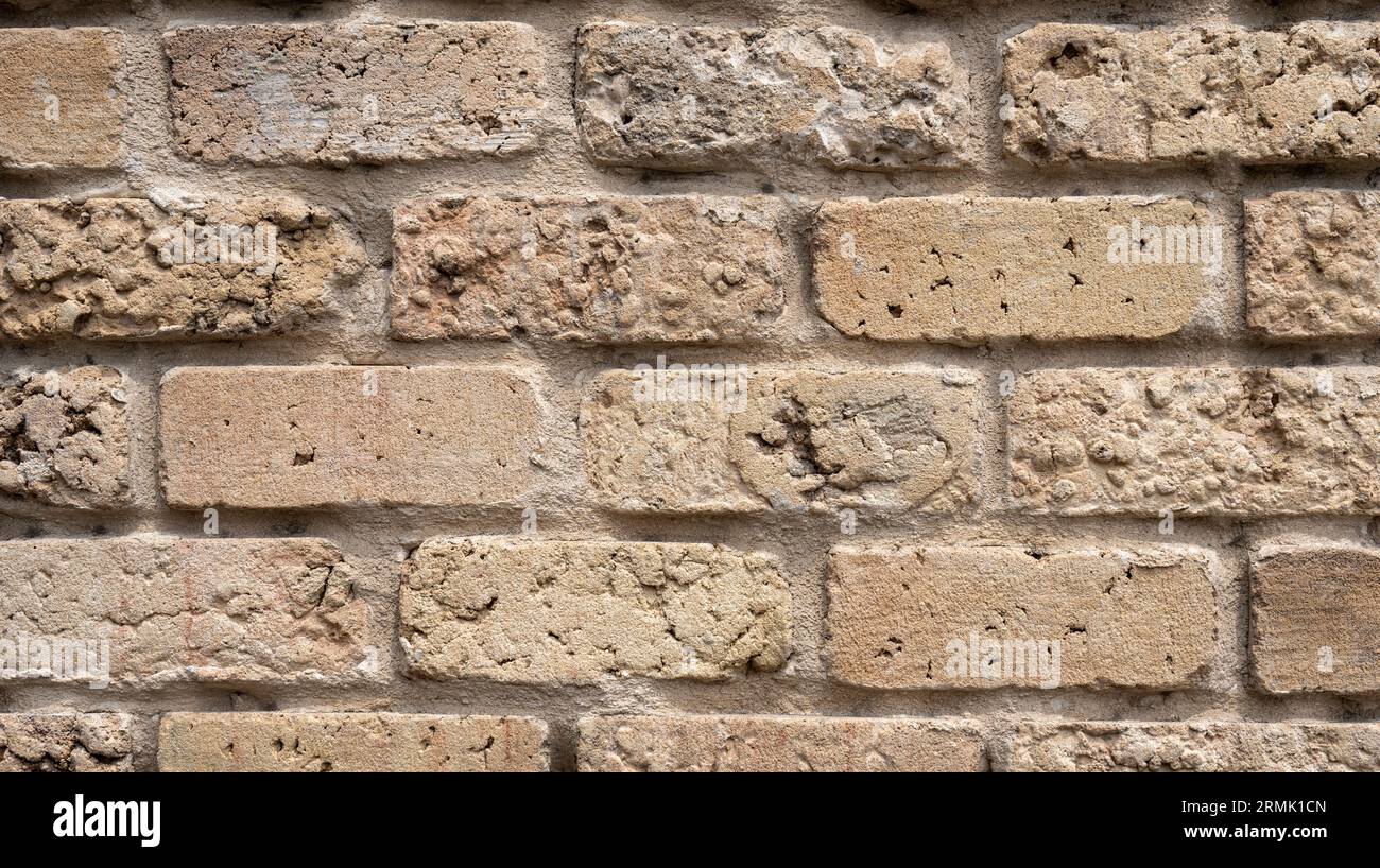 Textured crude stone wall close-up Stock Photo