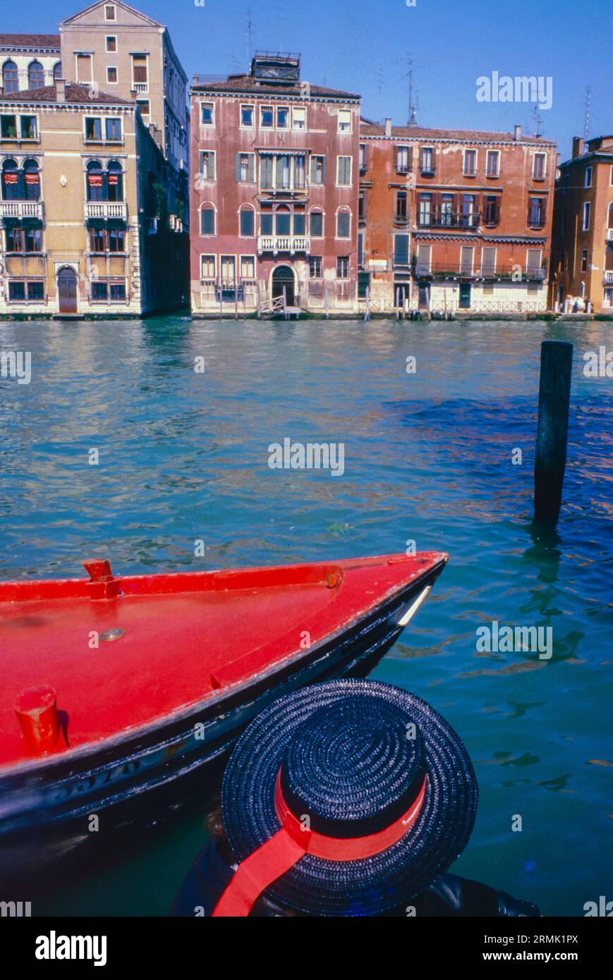 Typical Venetian hat in front of the Venice canal Stock Photo
