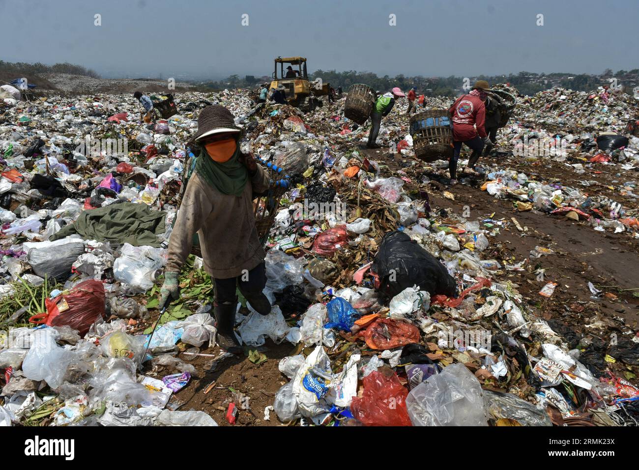 August 29, 2023, Malang city, East Java, Indonesia Scavengers work on