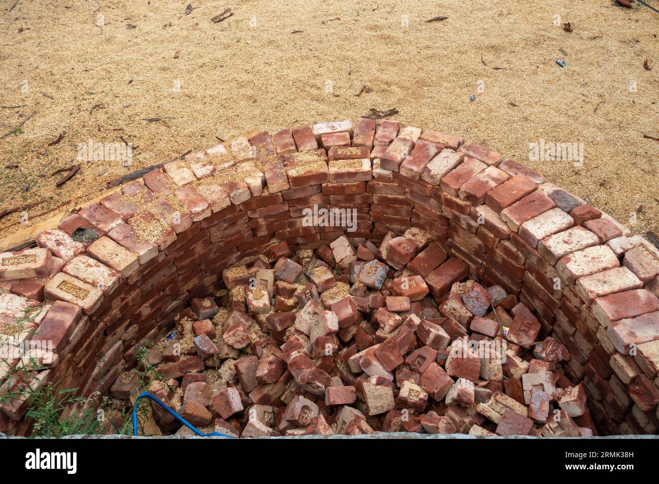 Building compact brick water harvesting tanks in rural Uttarakhand, India, for sustainable water conservation. Stock Photo