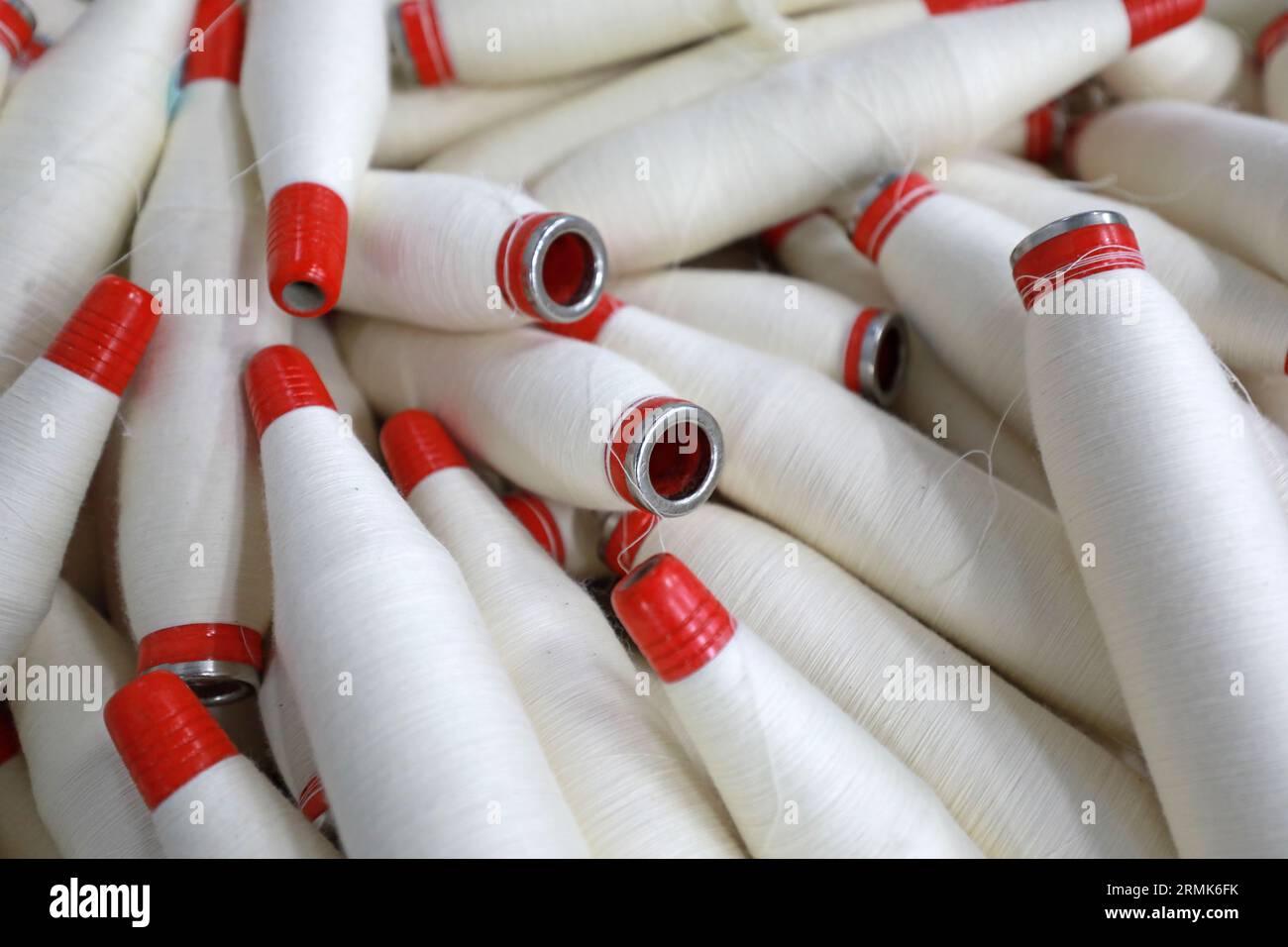 Cotton yarn is piled up in a spinning mill Stock Photo - Alamy