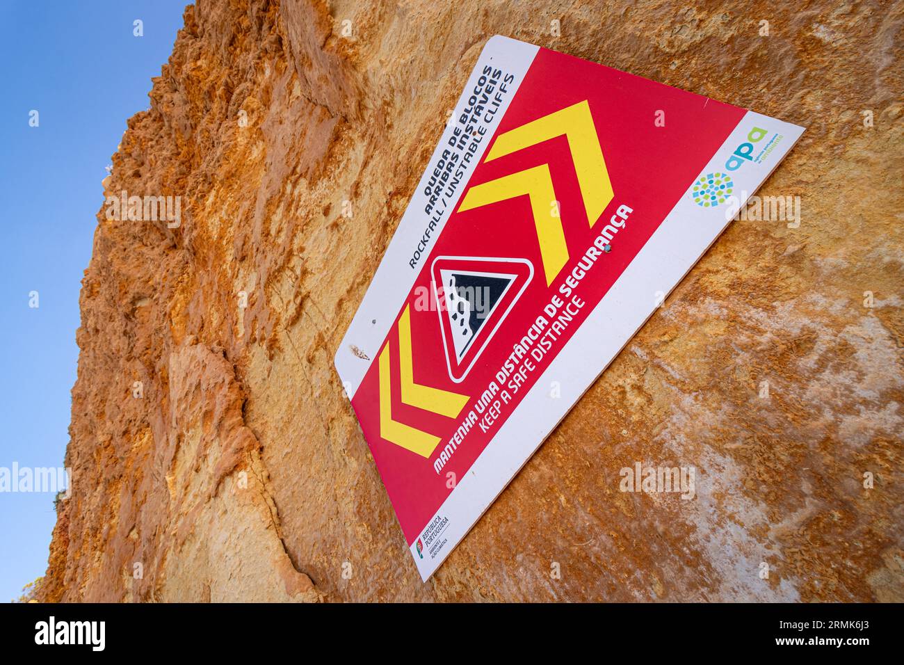 ROCKFALL UNSTABLE CLIFFS, KEEP A SAFE DISTANCE is written in English on ...