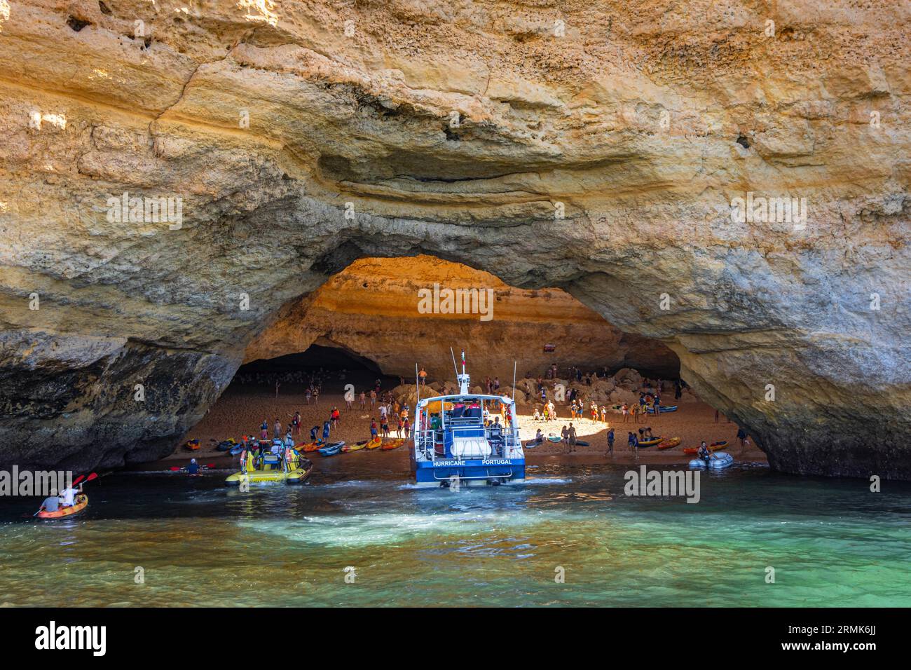 The world-famous Benagil Cave is only accessible from the sea and can be used at low tide. Numerous tourists from all over the world crowd into the Stock Photo