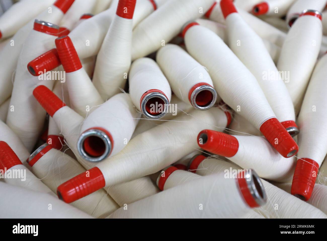 Cotton yarn is piled up in a spinning mill Stock Photo - Alamy