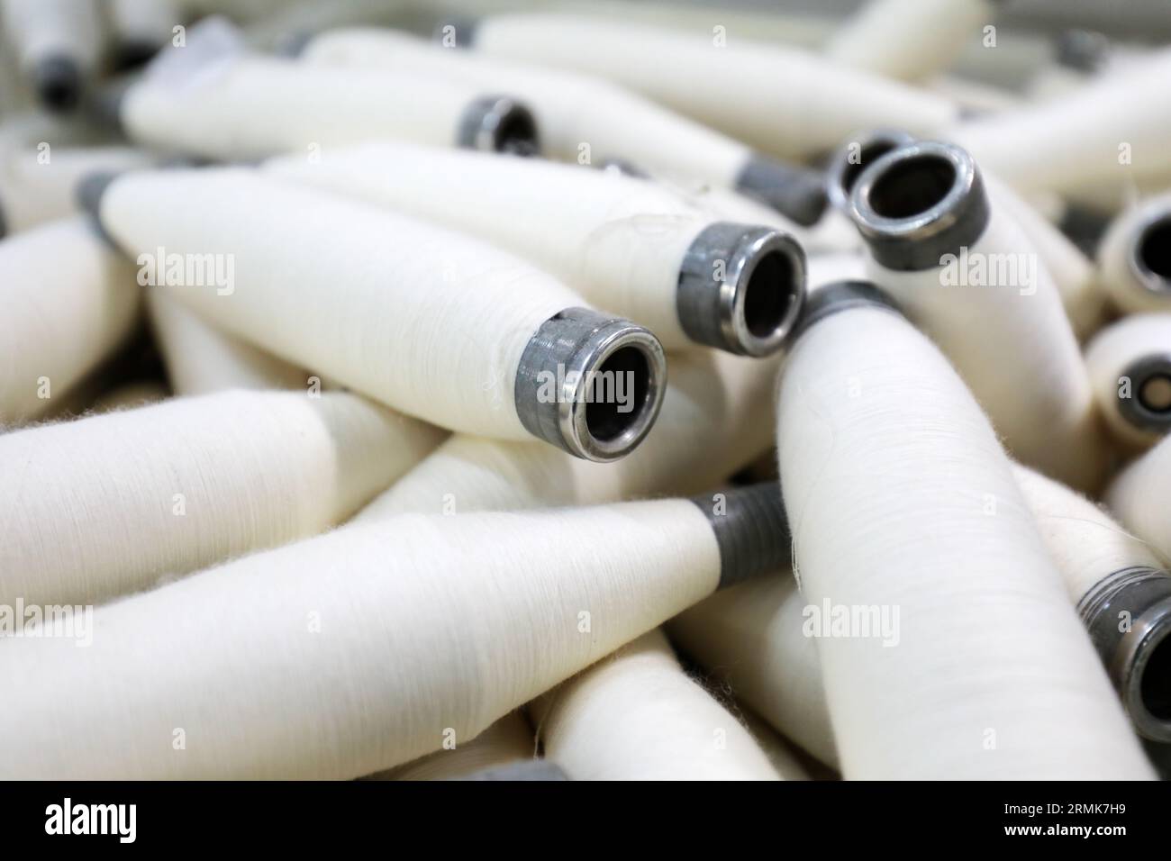 Cotton yarn is piled up in a spinning mill Stock Photo - Alamy