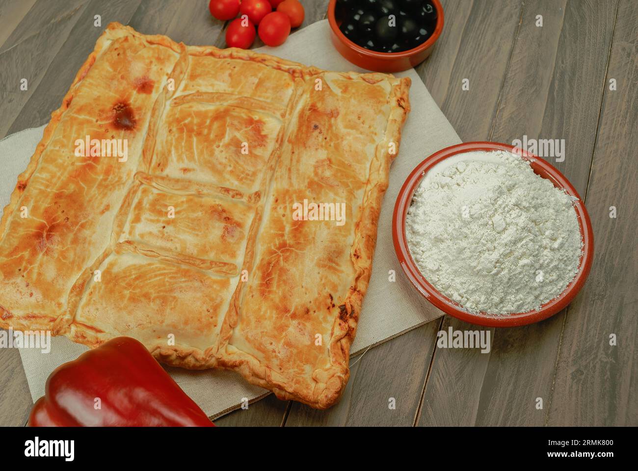 Empanada stuffed with tuna and tomato with homemade puff pastry dough