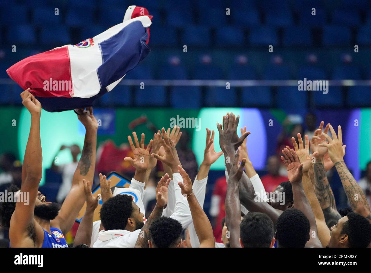 Dominican Republic team celebrates after winning against Angola during