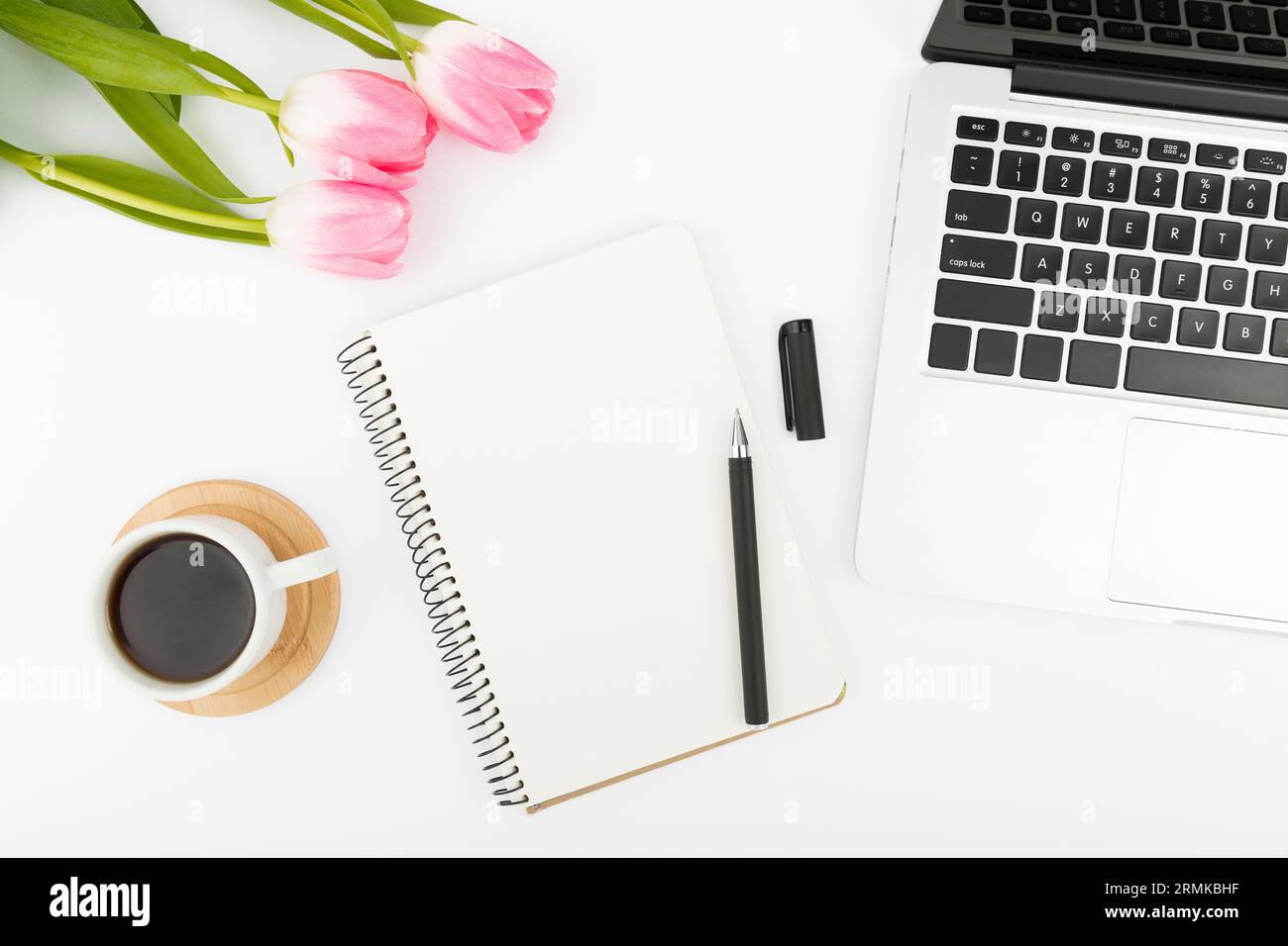 Flat lay desk concept with tulips Stock Photo