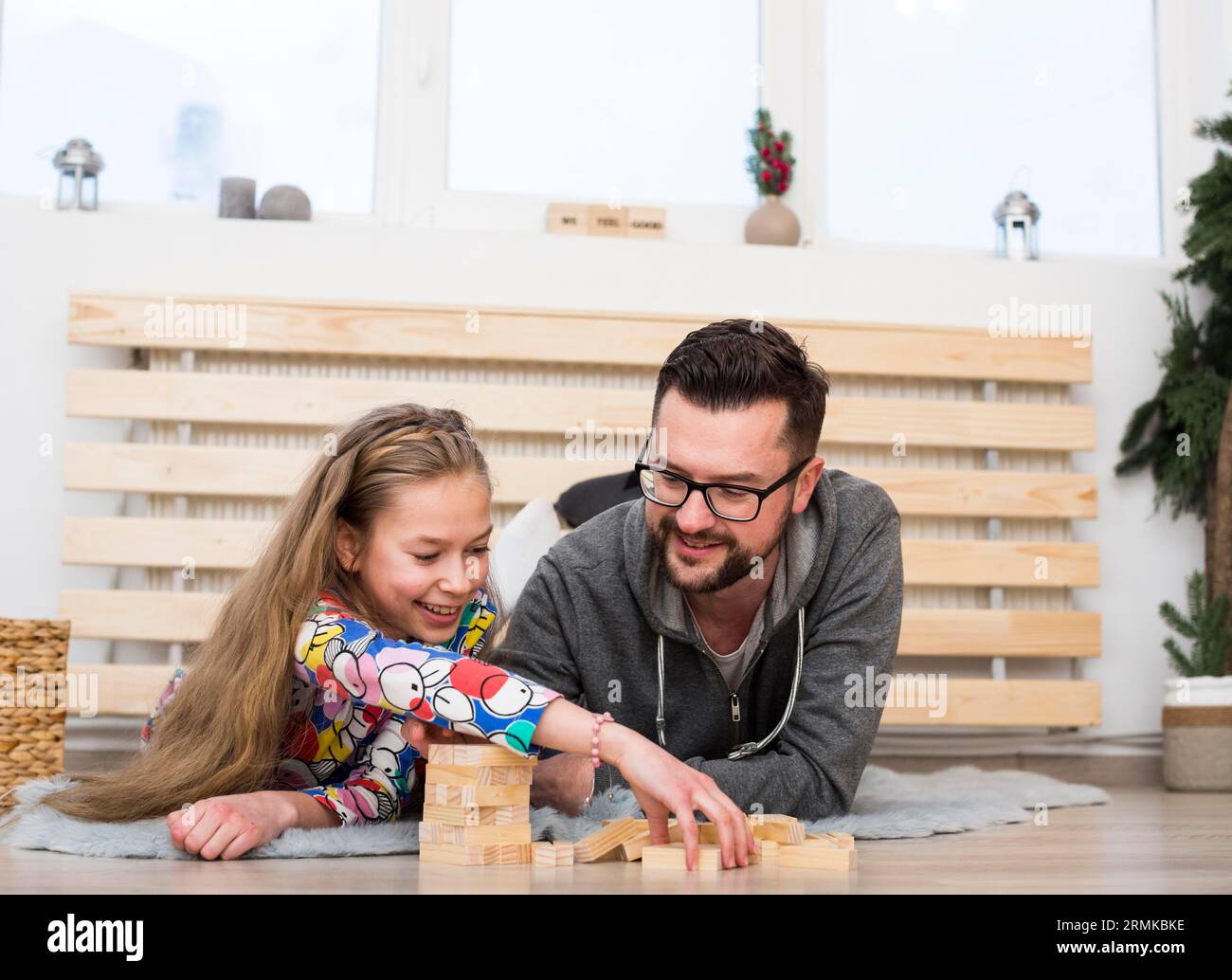 Father daughter playing with wood blocks Stock Photo