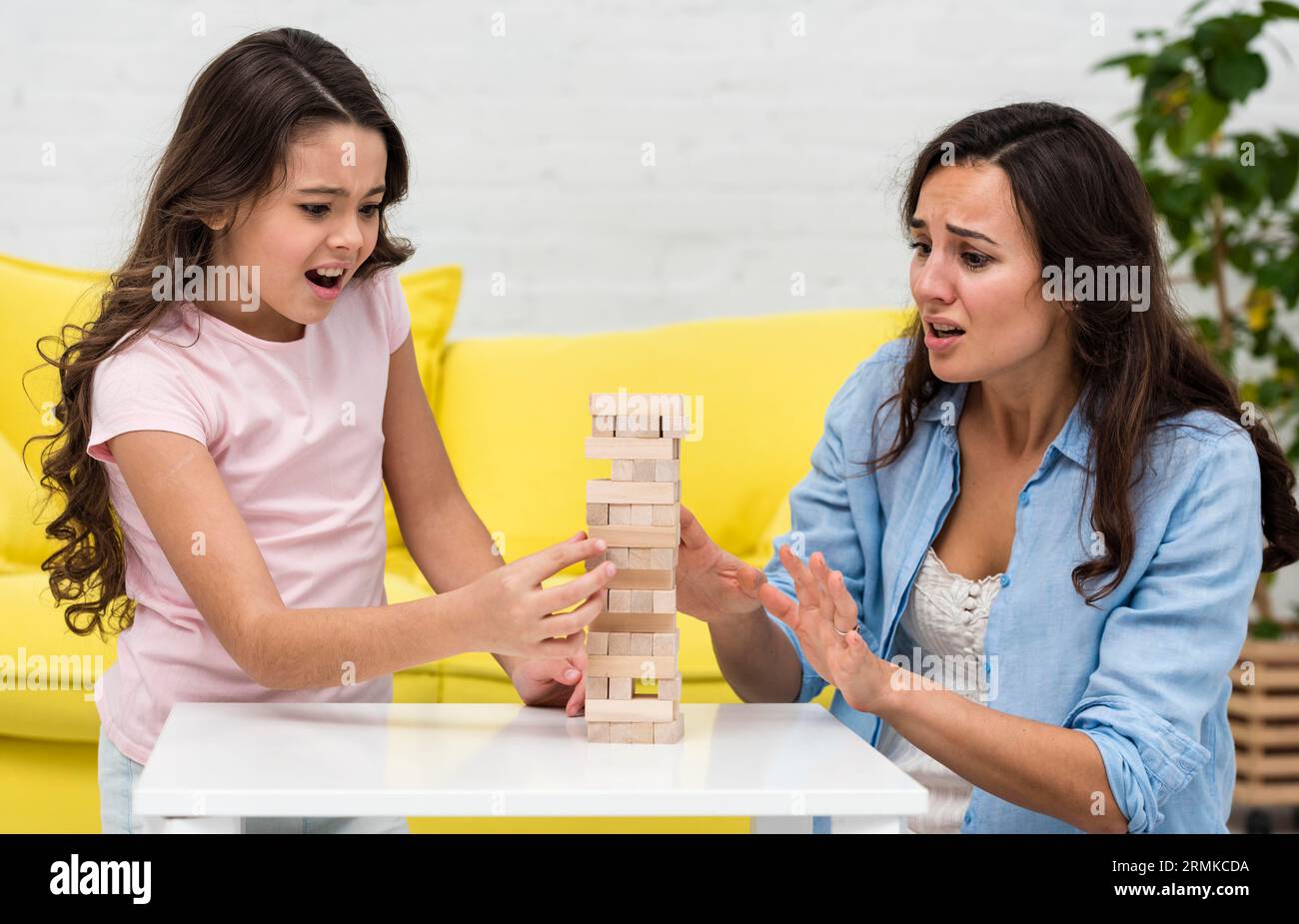Mother playing with her daughter boarding game Stock Photo