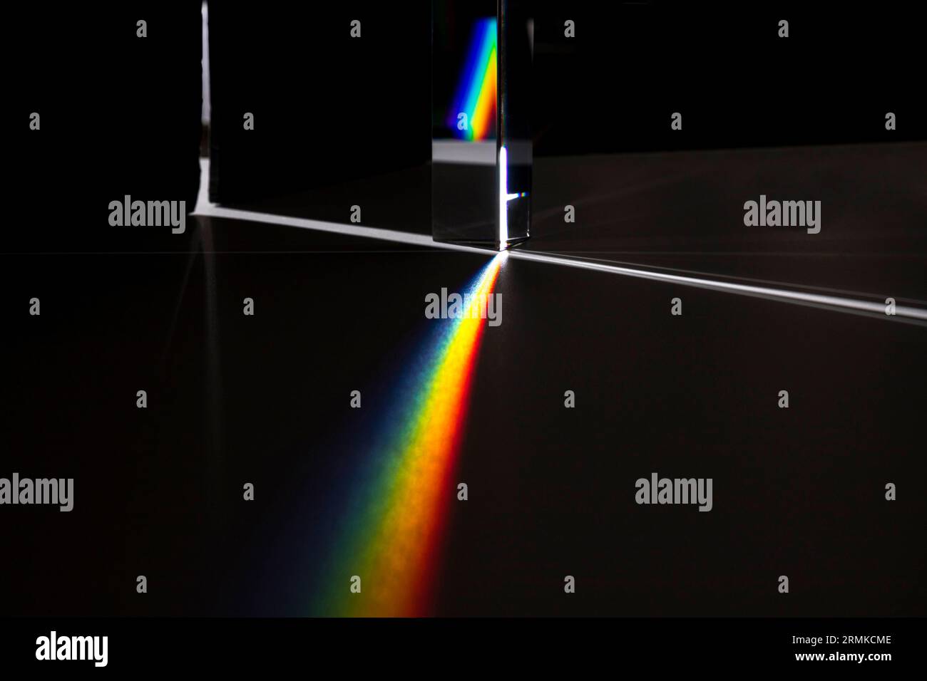 Prism dispersing light concept Stock Photo - Alamy