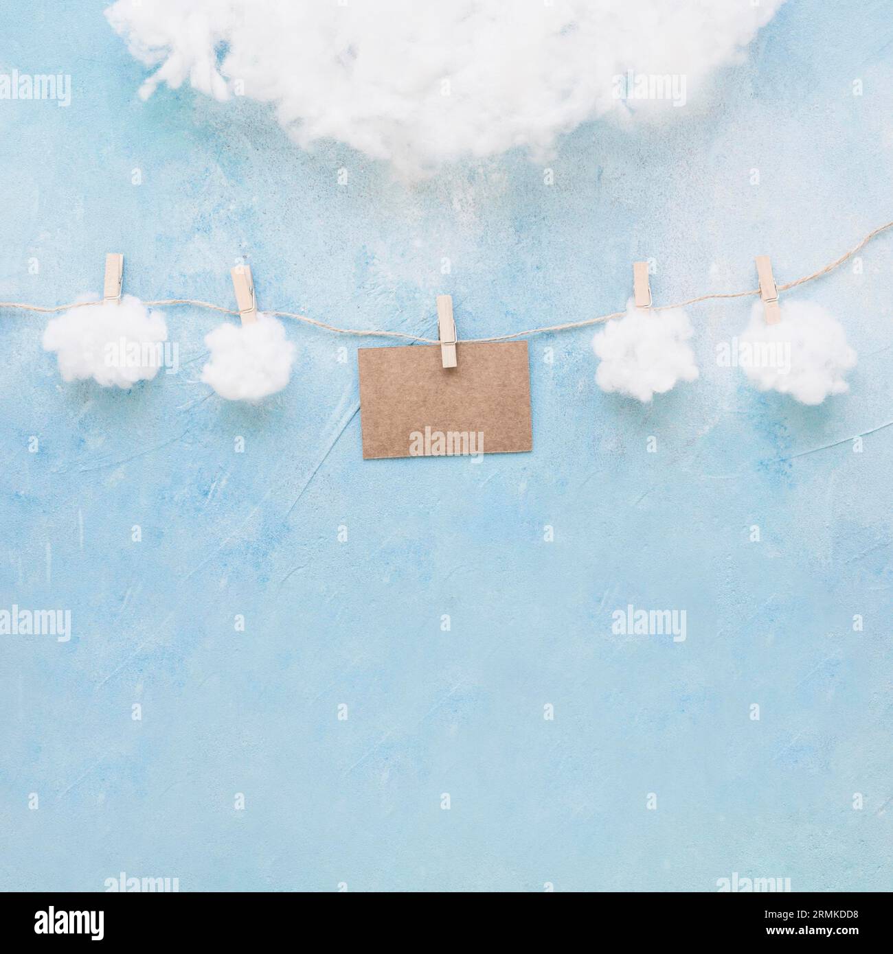 White clouds brown card hang string with clothespins Stock Photo Alamy