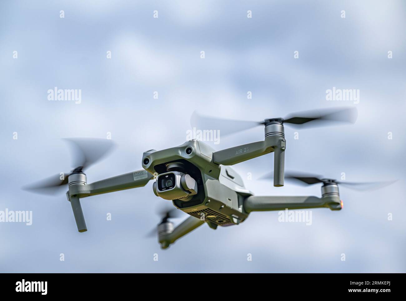 A DJI Air 2S Drone in flight against the sky Stock Photo