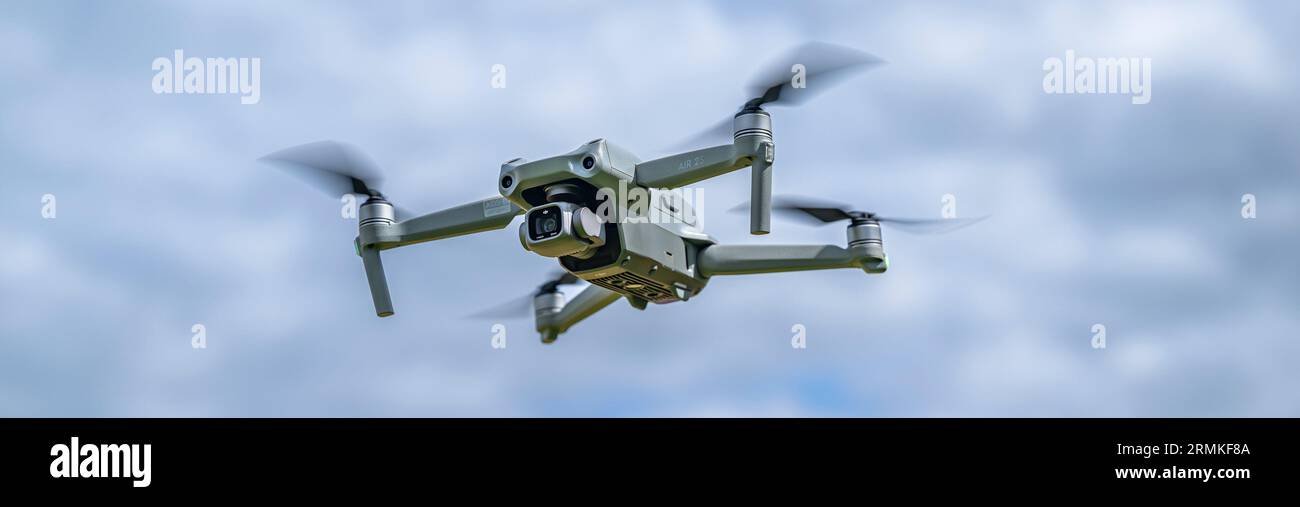 A DJI Air 2S Drone in flight against the sky Stock Photo