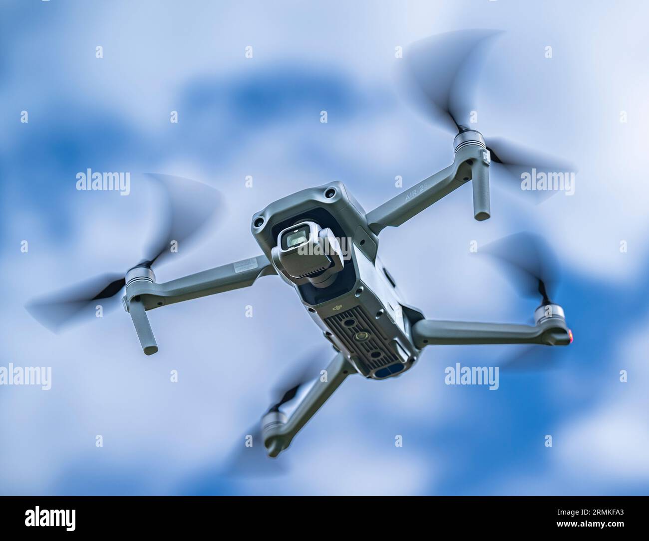 A DJI Air 2S Drone in flight against the sky Stock Photo