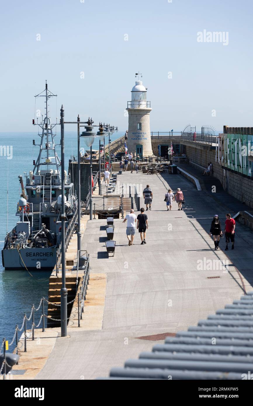 People enjoying a fay out at the Harbour Arm in Folkestone Kent England UK. Stock Photo