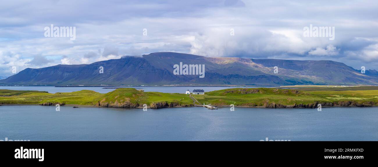 Panoramic view of typical scenic landscape in Iceland with pastures near fjords and glaciers. Stock Photo