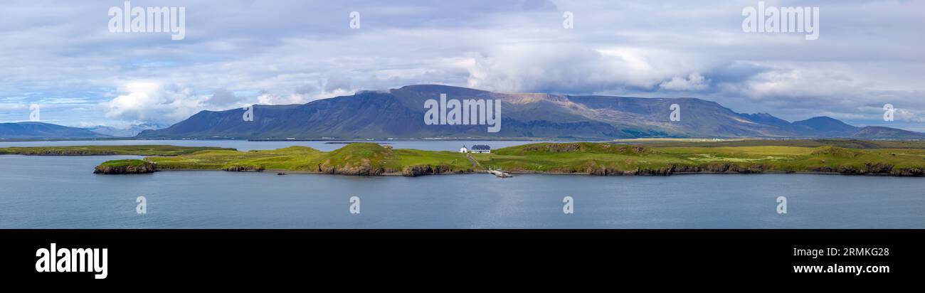 Panoramic view of typical scenic landscape in Iceland with pastures near fjords and glaciers. Stock Photo