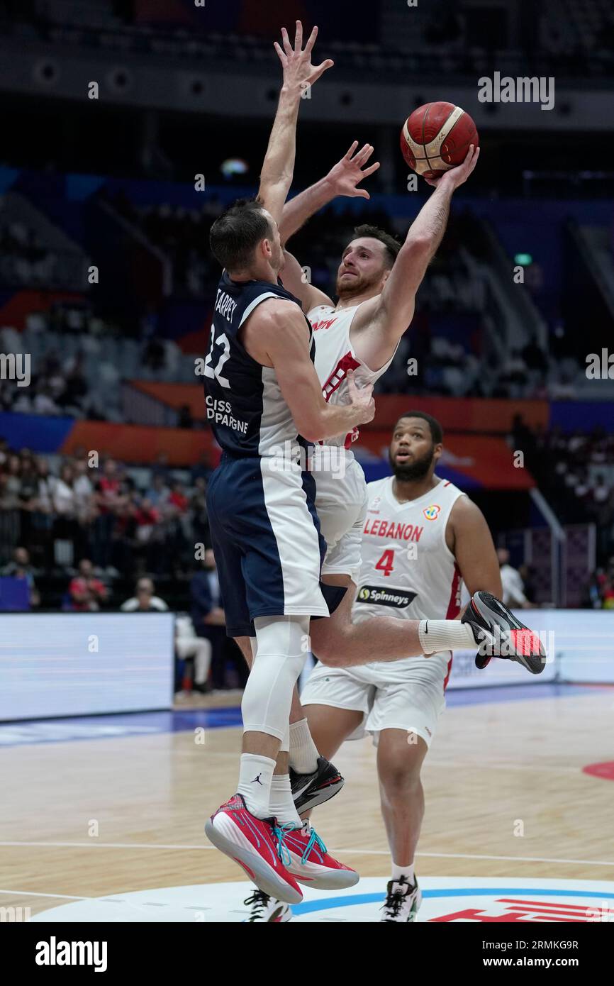 Lebanon guard Wael Arakji (20) shoots against France forward Terry Tarpey (22) during the Basketball World Cup group H match between France and Lebanon at the Indonesia Arena stadium in Jakarta, Indonesia,