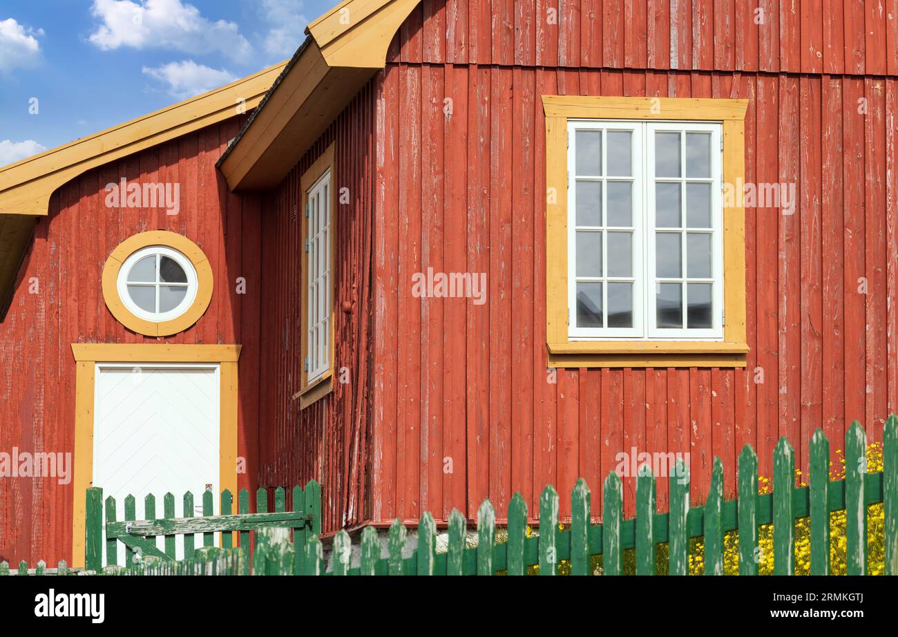 Typical architecture of Greenland capital Nuuk with colored houses located near fjords and icebergs. Stock Photo